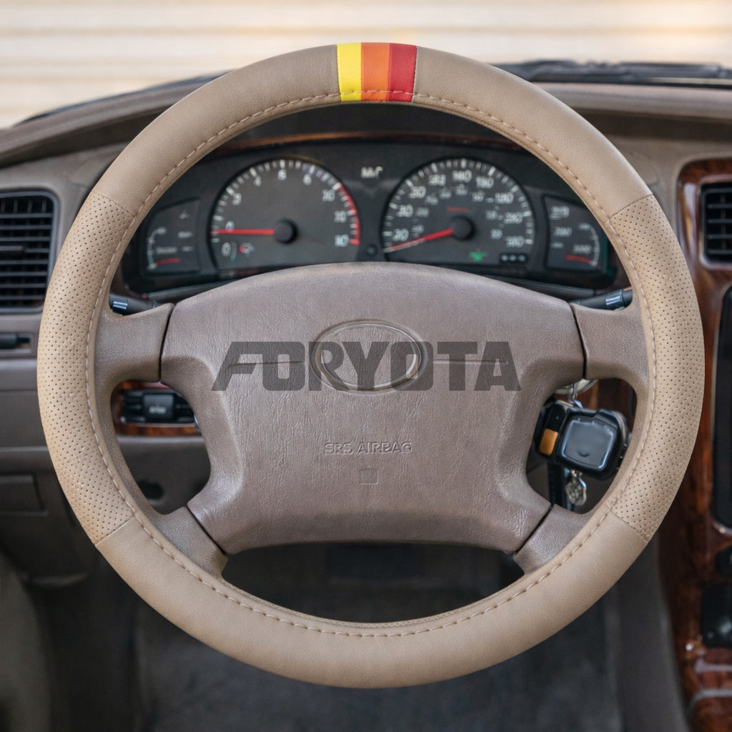 tan steering wheel cover with TRD stripes. Fits 4runner and tacoma and other models